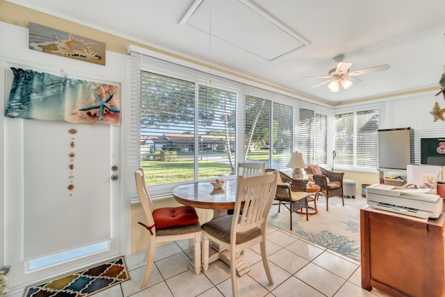 sunroom with ceiling fan and plenty of natural light