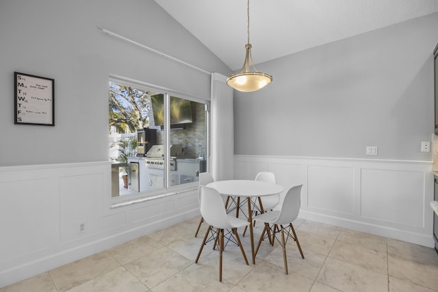 tiled dining room with vaulted ceiling