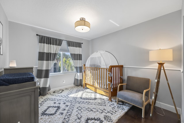 bedroom with wood-type flooring