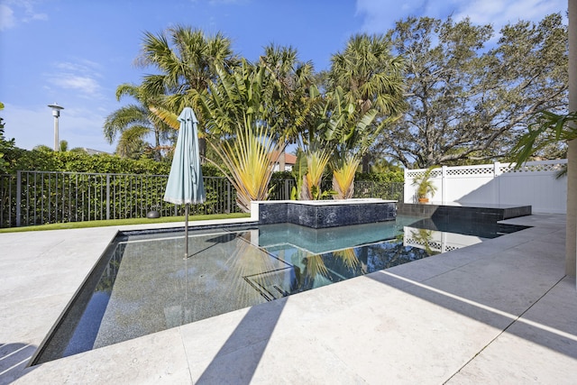 view of swimming pool featuring a patio