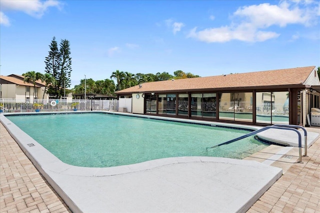 view of swimming pool featuring a patio area