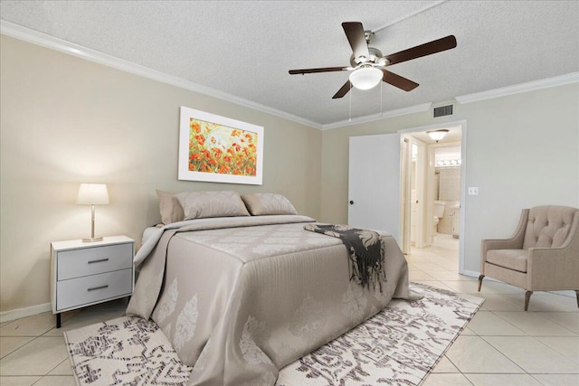 tiled bedroom featuring ensuite bath, ceiling fan, a textured ceiling, and ornamental molding