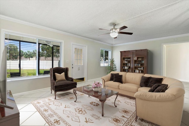 living room with light tile patterned floors, a textured ceiling, ceiling fan, and crown molding