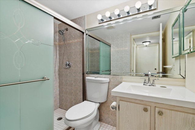 bathroom with walk in shower, vanity, tile walls, and toilet