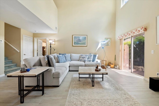 living room with a high ceiling