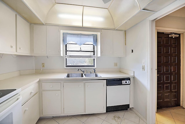 kitchen with white cabinets, light tile patterned floors, white appliances, and sink