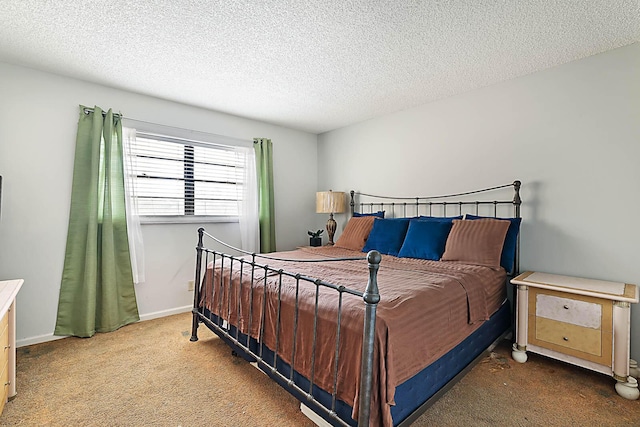 carpeted bedroom with a textured ceiling