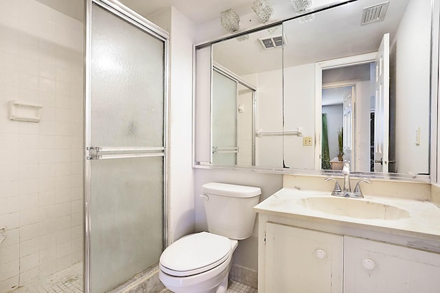 bathroom with vanity, toilet, and walk in shower