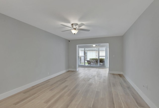 empty room with ceiling fan and light wood-type flooring