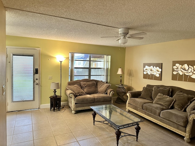 tiled living room featuring a textured ceiling and ceiling fan