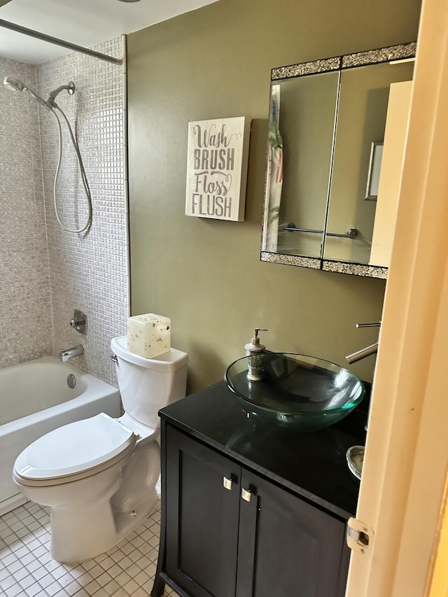 full bathroom with tile patterned flooring, vanity, toilet, and tiled shower / bath combo