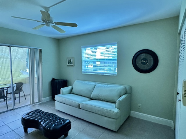 living room featuring plenty of natural light, ceiling fan, and light tile patterned floors