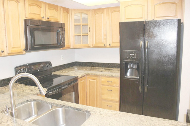 kitchen with sink, black appliances, and light brown cabinets