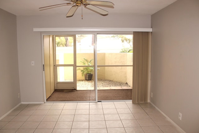 doorway to outside with ceiling fan and light tile patterned floors