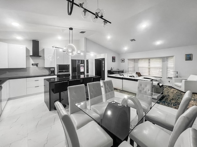 dining area with lofted ceiling