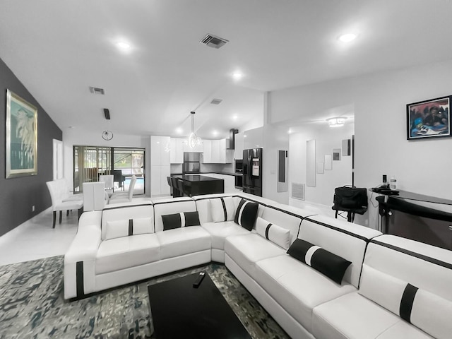 living room featuring vaulted ceiling