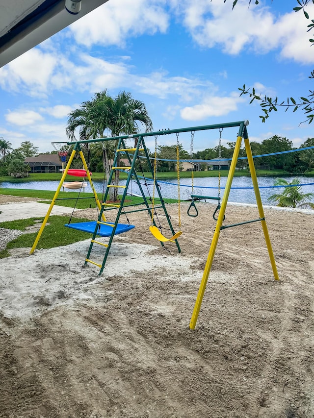 view of jungle gym featuring a water view