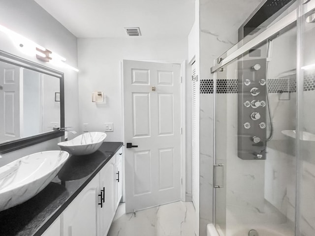 bathroom with vanity and walk in shower