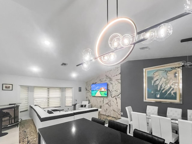 dining room featuring lofted ceiling