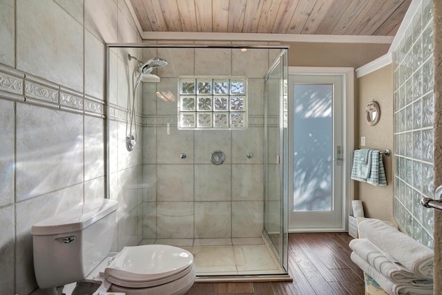 bathroom featuring hardwood / wood-style flooring, ornamental molding, wood ceiling, and toilet