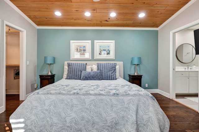 bedroom featuring dark hardwood / wood-style flooring, connected bathroom, a spacious closet, and wooden ceiling