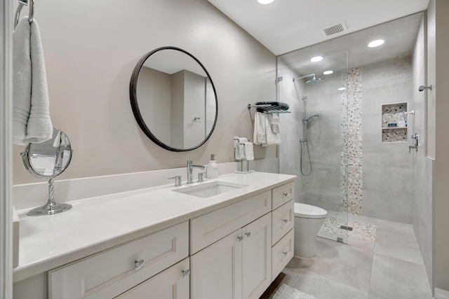 bathroom featuring walk in shower, vanity, and toilet