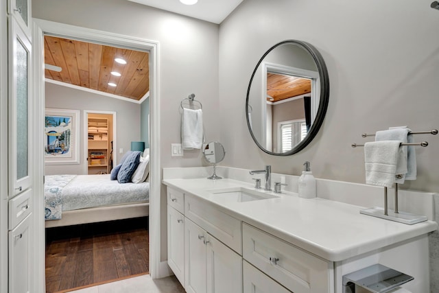 bathroom with tile patterned floors, lofted ceiling, vanity, and wooden ceiling