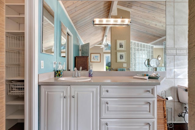 bathroom with wood ceiling, ceiling fan, vanity, and vaulted ceiling