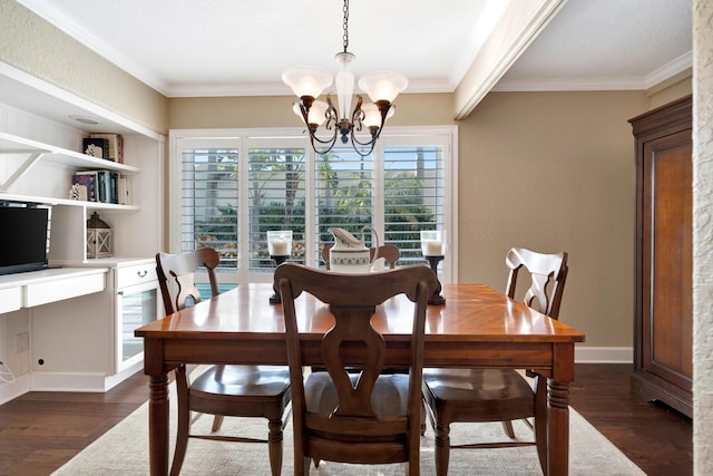 dining room featuring ornamental molding, dark hardwood / wood-style floors, and a notable chandelier