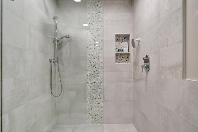 bathroom with tiled shower