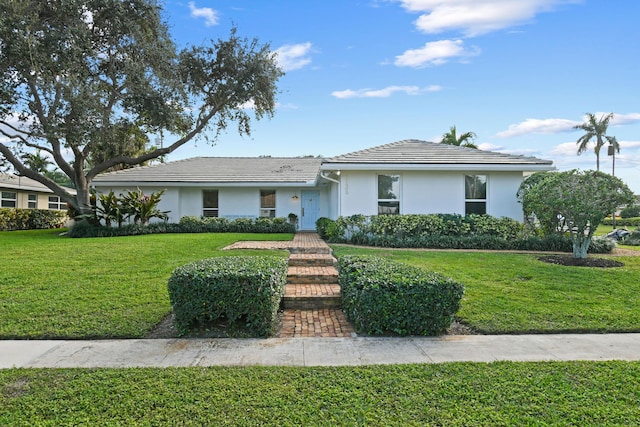 single story home with a front yard