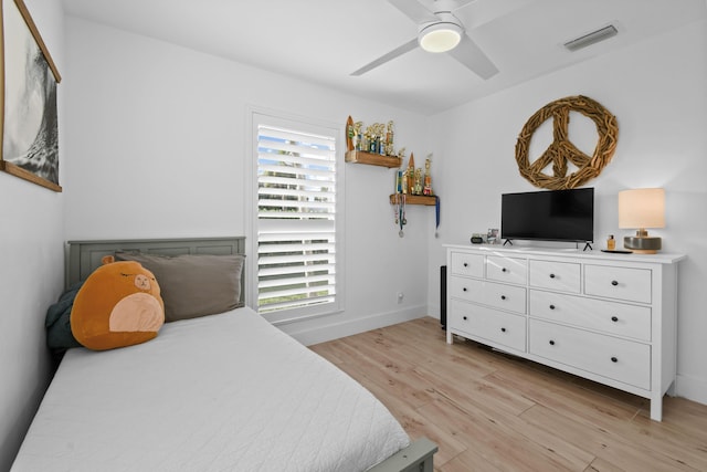 bedroom featuring light wood-type flooring and ceiling fan