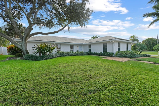 ranch-style home with a front yard