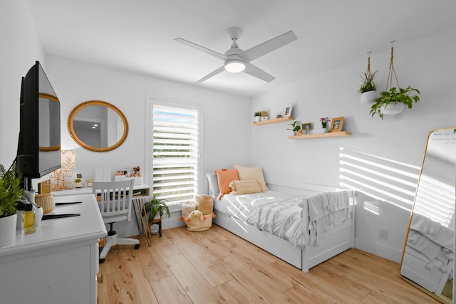 bedroom with light wood-type flooring and ceiling fan