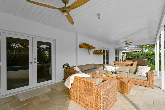 view of patio / terrace featuring french doors, ceiling fan, a hot tub, and an outdoor living space