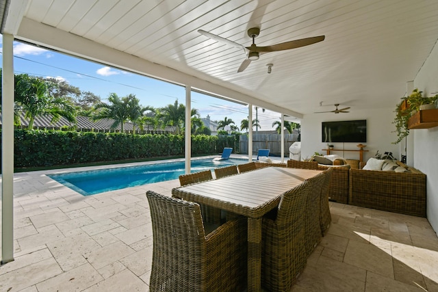 view of swimming pool featuring a patio area, ceiling fan, and an outdoor hangout area