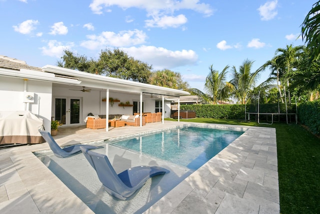 view of pool featuring a patio, french doors, grilling area, a trampoline, and outdoor lounge area