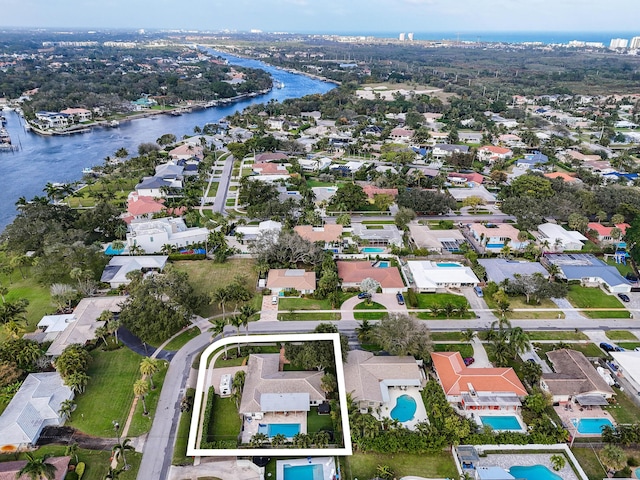 birds eye view of property with a water view