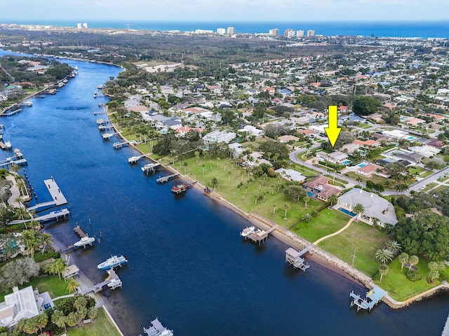 birds eye view of property featuring a water view