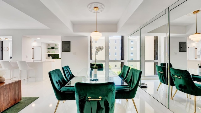 dining area featuring electric panel and light tile patterned flooring