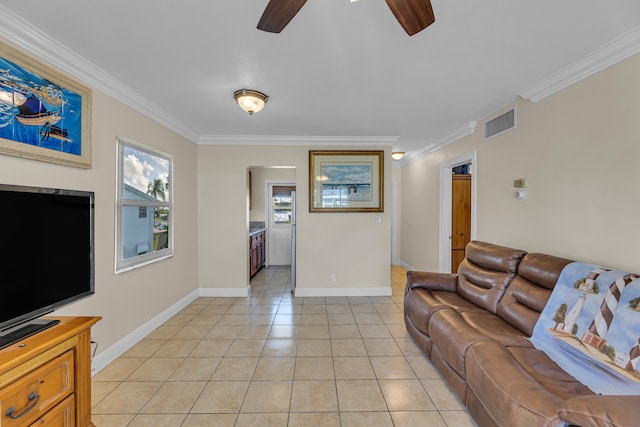 tiled living room featuring crown molding and ceiling fan