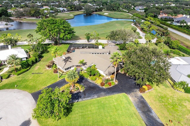 aerial view with a residential view, view of golf course, and a water view