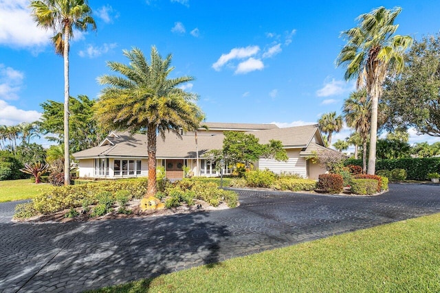 view of front of home featuring decorative driveway