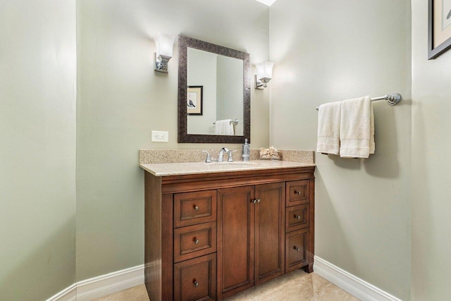 bathroom featuring baseboards and vanity