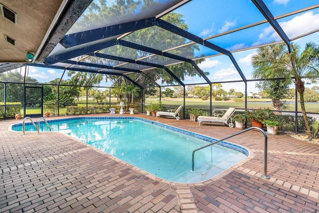 pool with a lanai and a patio area