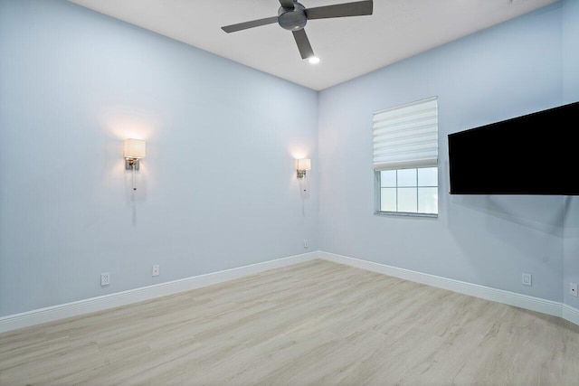 spare room with ceiling fan and light hardwood / wood-style floors