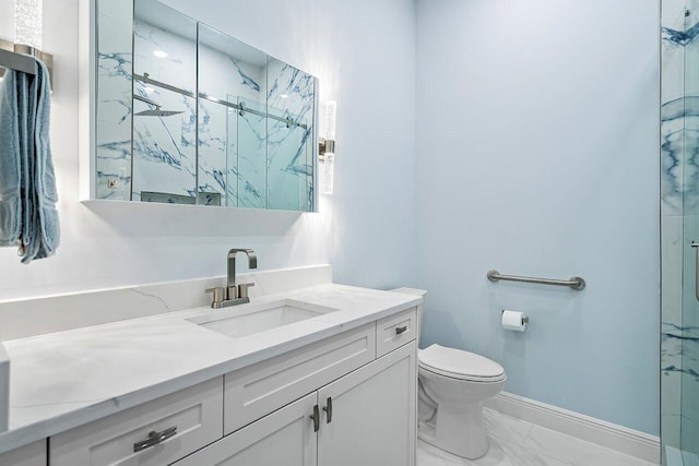 bathroom featuring vanity, an enclosed shower, and toilet