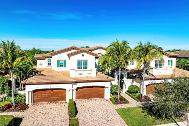 mediterranean / spanish-style house featuring a balcony