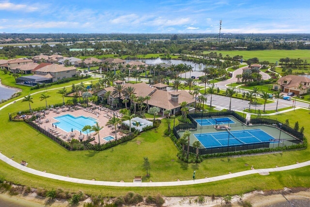 birds eye view of property with a water view