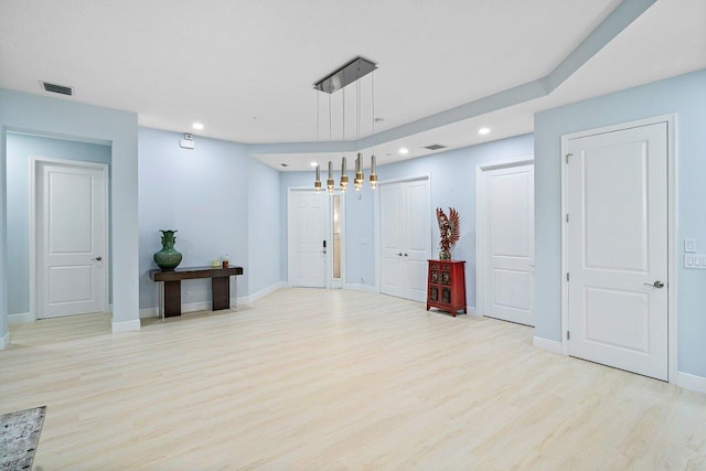 unfurnished room featuring light wood-type flooring